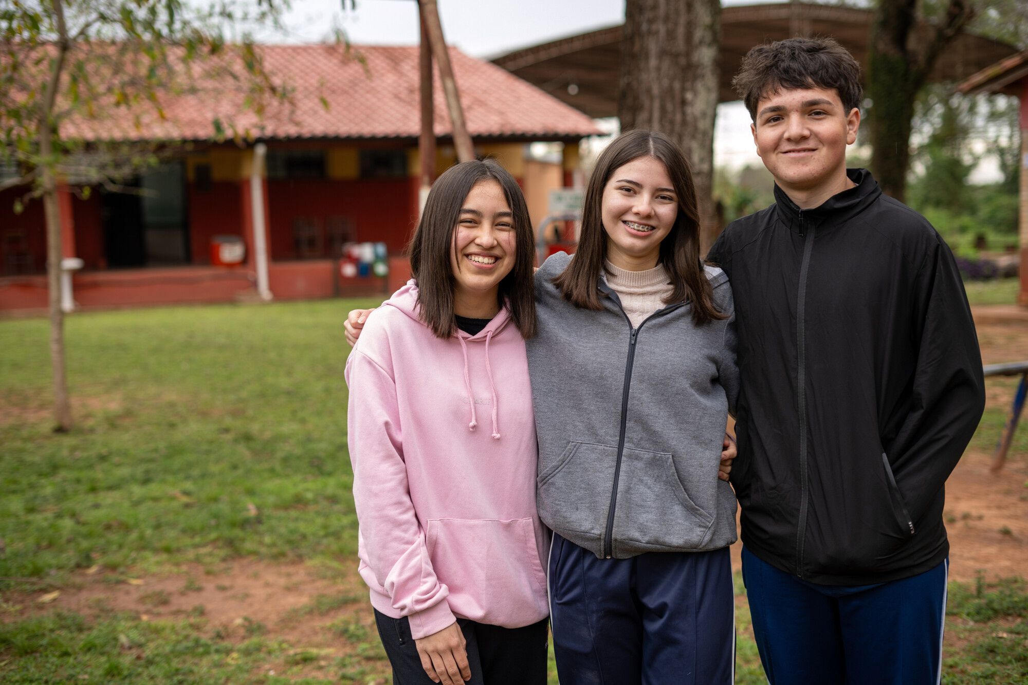 Jazmín, Cami and Ronny in their old school playground  