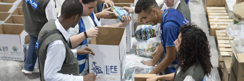 Preparing boxes of food aid for delivery to Gaza  